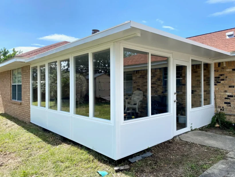 Glass room addition on a home in Pace, FL, built by Navy Point Patio & Screen
