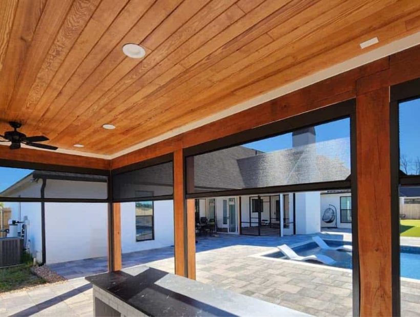 Motorized screens enclosing a covered patio in Daphne, Alabama